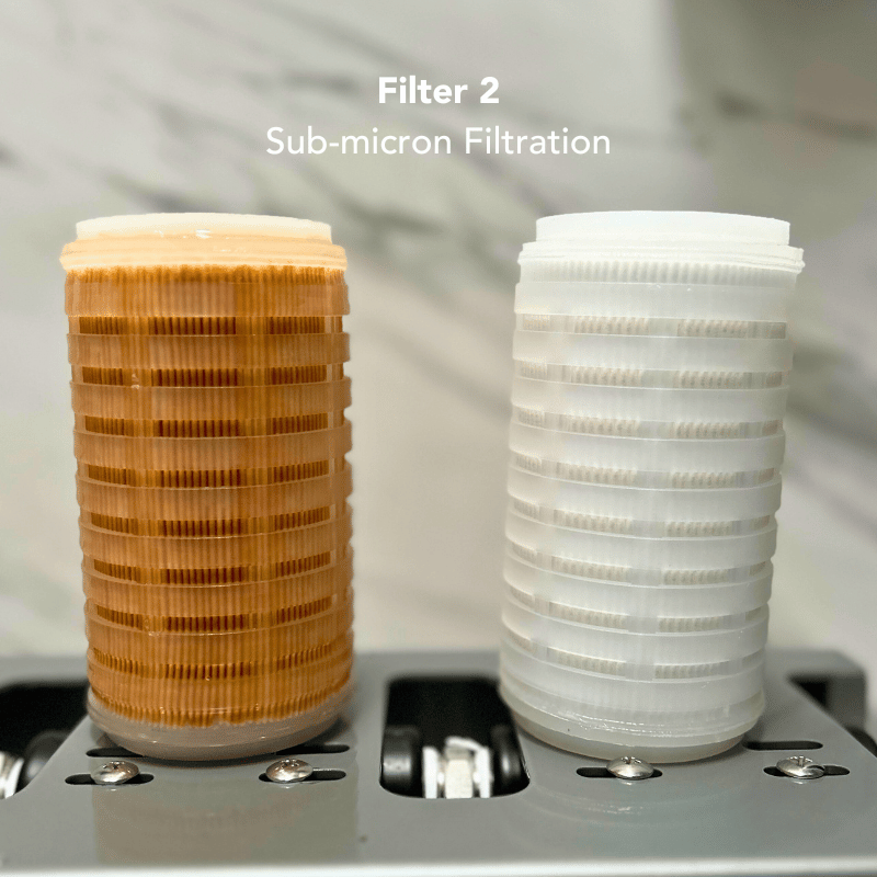 A used sub-micron filter compared to a new sub-micron filter.
