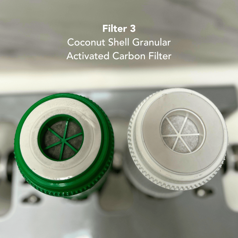 A used coconut shell granular activated carbon filter compared to a new one.